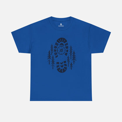 Royal Blue Boot Print Compass Forest T-Shirt worn by model in a pine forest setting, showcasing rugged hiking design for nature lovers.