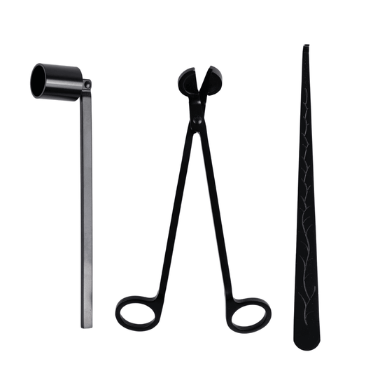 Set of black candle care metal tools on white background including a wick trimmer, a crooked wick adjuster, a matching storage tray, and a fully hinged Matte Black Candle Snuffer.