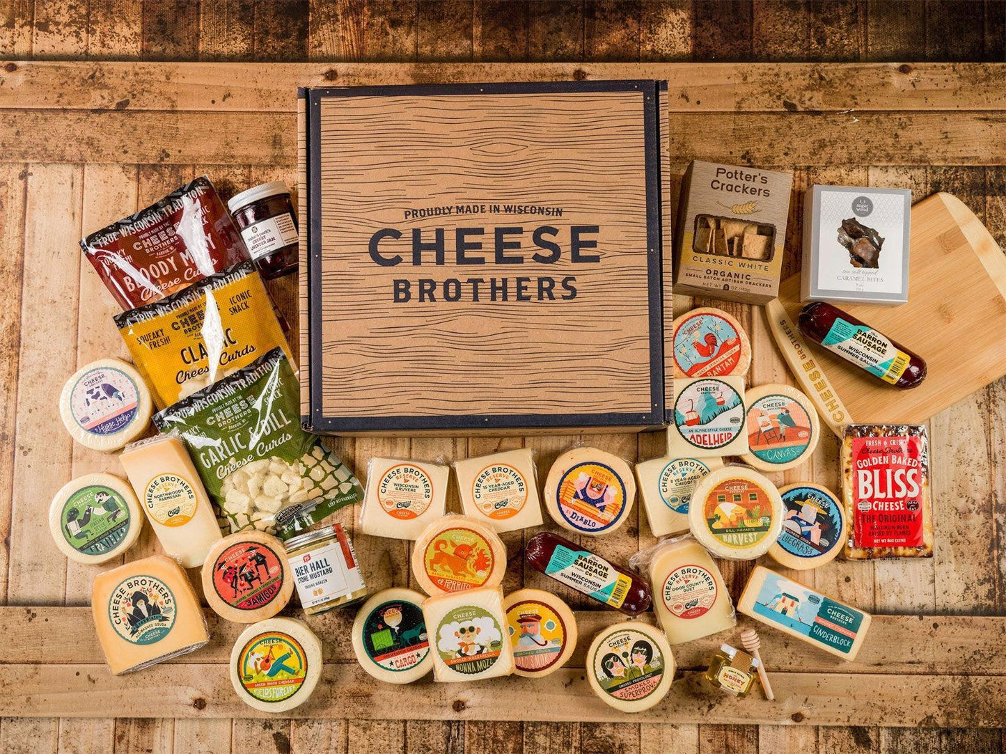 Ultimate Wisconsin Cheese Heritage Gift Box with 15-Year Aged Cheddar, 17 Artisan Blocks, Curds, and Bamboo Board.