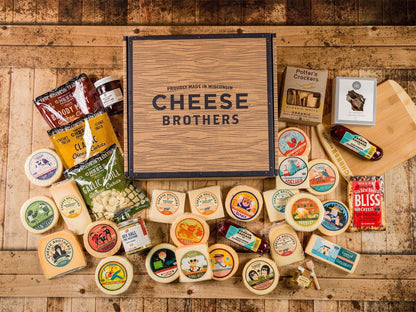 Ultimate Wisconsin Cheese Heritage Gift Box with 15-Year Aged Cheddar, 17 Artisan Blocks, Curds, and Bamboo Board.