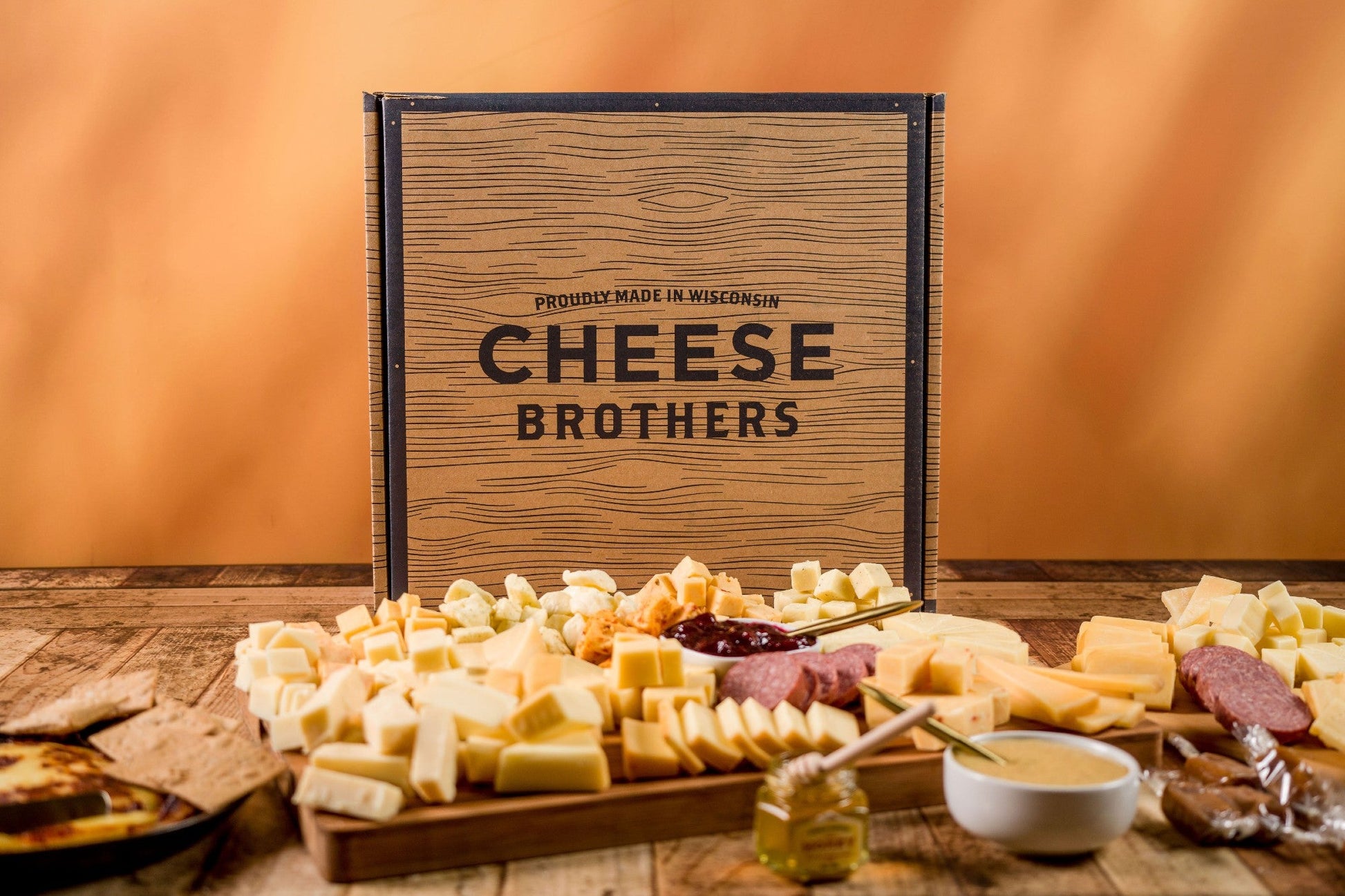 Ultimate Wisconsin Cheese Heritage Gift Box with 15-Year Aged Cheddar, 17 Artisan Blocks, Curds, and Bamboo Board.
