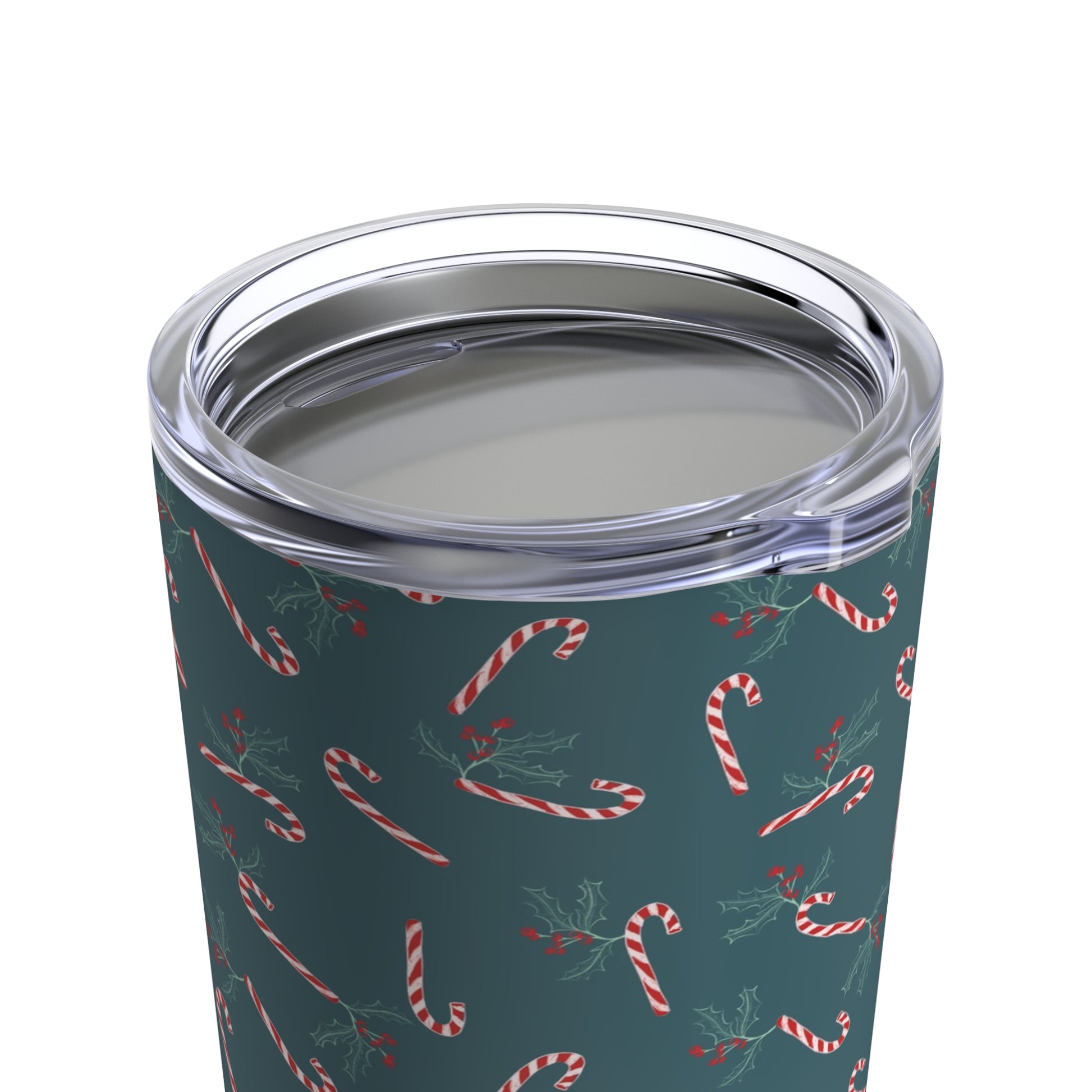 Close-up view of a 20oz tumbler featuring a candy cane and holly holiday pattern, highlighting the festive design details and quality of the tumbler.