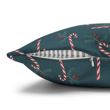 Close-up view of the zipper on a square pillow case featuring a candy cane and holly pattern, showcasing the quality and design details of the festive cover.