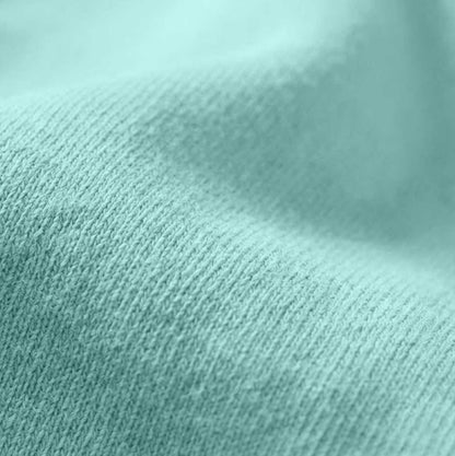 Close-up texture of the 6.4 oz Comfort Colors 1466 garment-dyed cotton in Chalky Mint, showcasing the soft-washed, non-synthetic natural fiber grain.