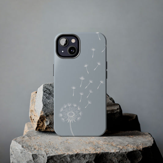 Dandelion Phone Case with a delicate drifting dandelion seed design, shown on a rock for a nature-inspired aesthetic.