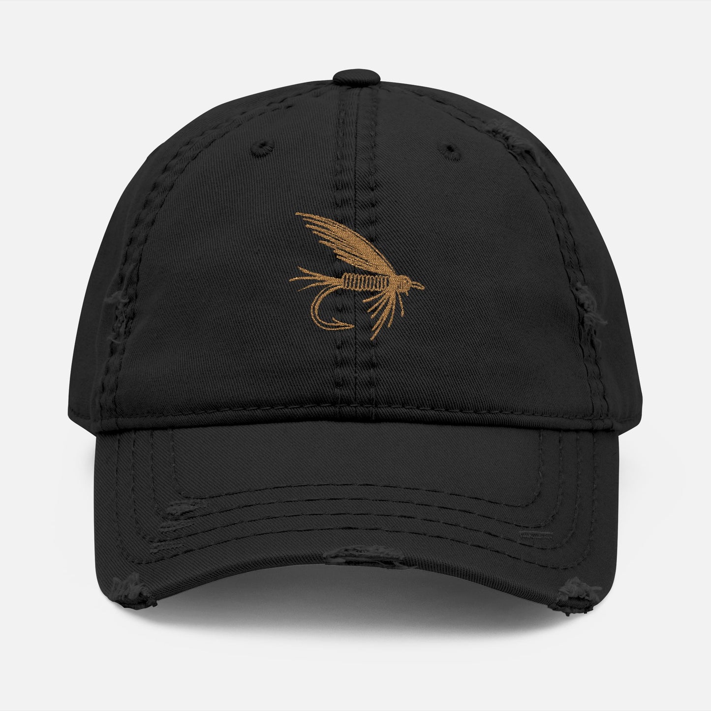 Front view of black option featuring the Distressed Fishing Fly Dad Hat on a white background, showing the embroidered fishing fly design and pre-worn, rugged cotton twill finish.