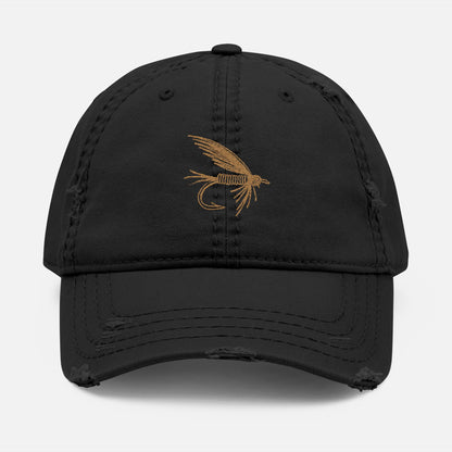 Front view of black option featuring the Distressed Fishing Fly Dad Hat on a white background, showing the embroidered fishing fly design and pre-worn, rugged cotton twill finish.