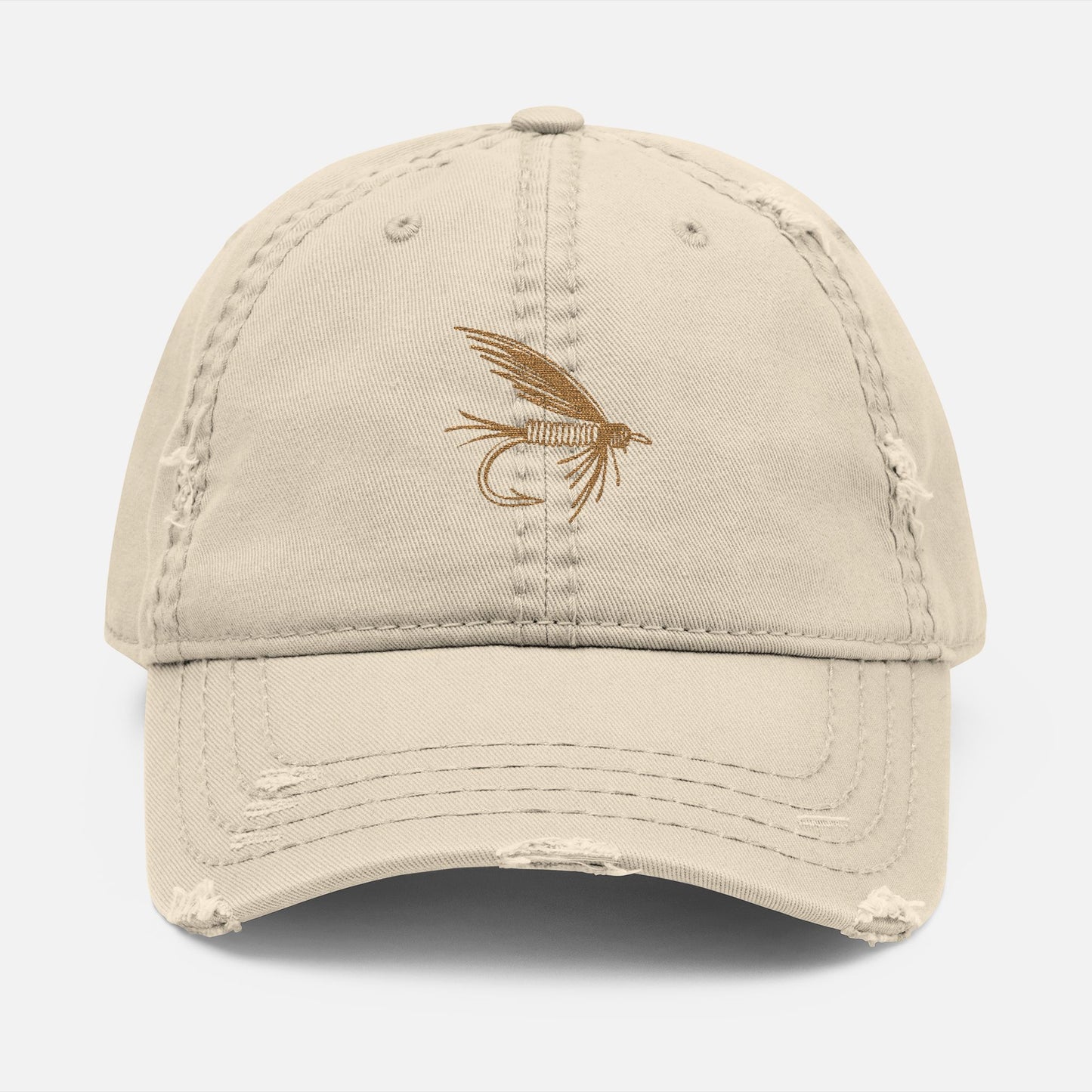 Front view of tan option featuring the Distressed Fishing Fly Dad Hat on a white background, showing the embroidered fishing fly design and pre-worn, rugged cotton twill finish.