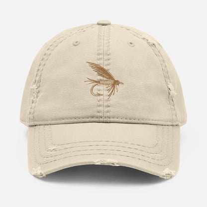 Front view of tan option featuring the Distressed Fishing Fly Dad Hat on a white background, showing the embroidered fishing fly design and pre-worn, rugged cotton twill finish.