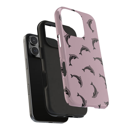 A dolphin pattern phone case with a purple color base on a white background with expanded view showing the shock absorbing rubber liner. Perfect for anyone who loves the ocean.