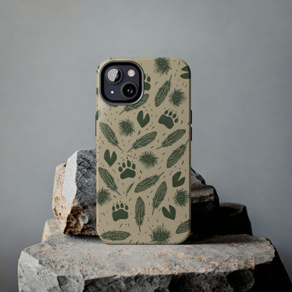 Feathers, Fur & Footprints Phone Case resting on a rock with a grey background, showcasing nature-inspired track and texture illustrations.
