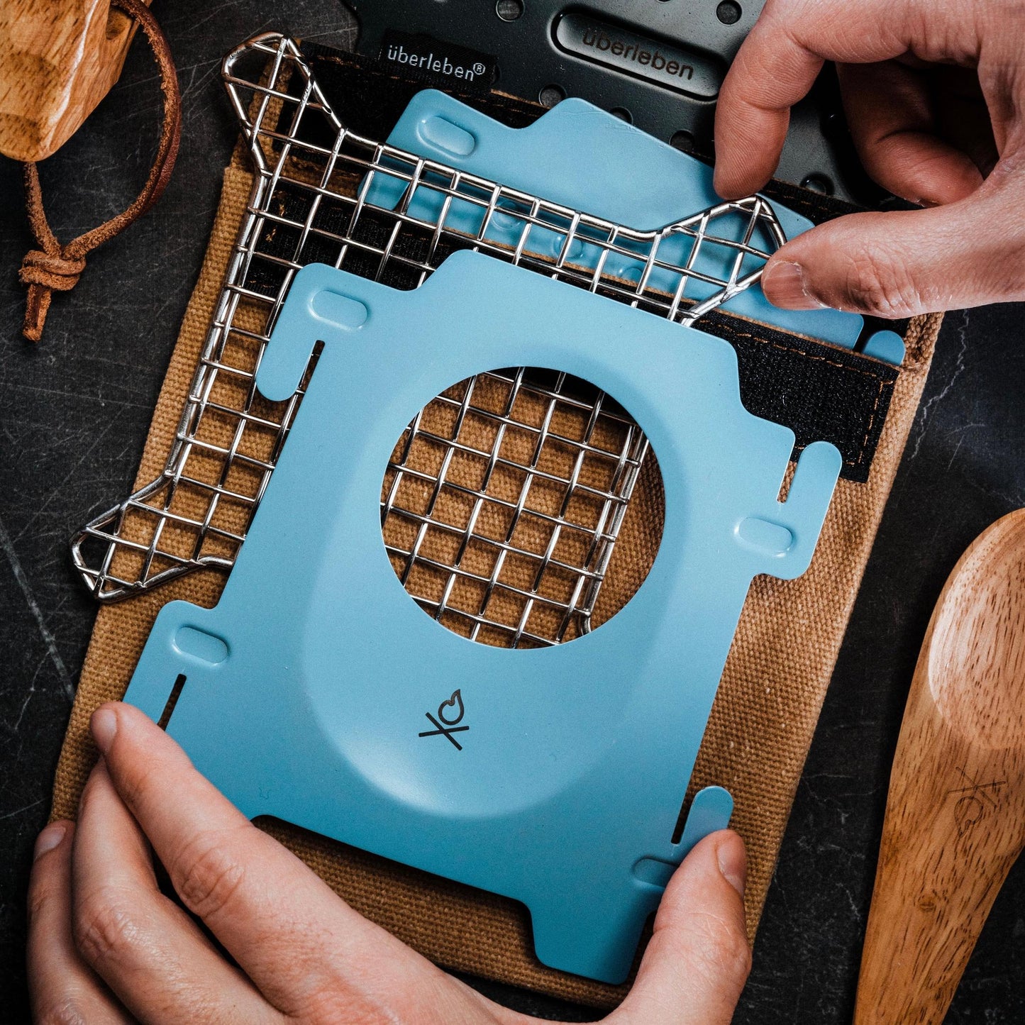 The Stöker Stove by Überleben in blue showing flatlay.