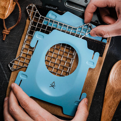 The Stöker Stove by Überleben in blue showing flatlay.