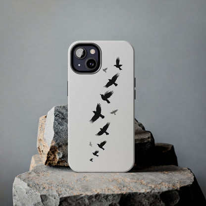 Flying Crows Silhouette Phone Case shown on a rock, highlighting its bold black bird design and sleek, minimalist aesthetic.