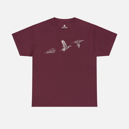 Three flying ducks silhouette on a maroon t-shirt on white background.