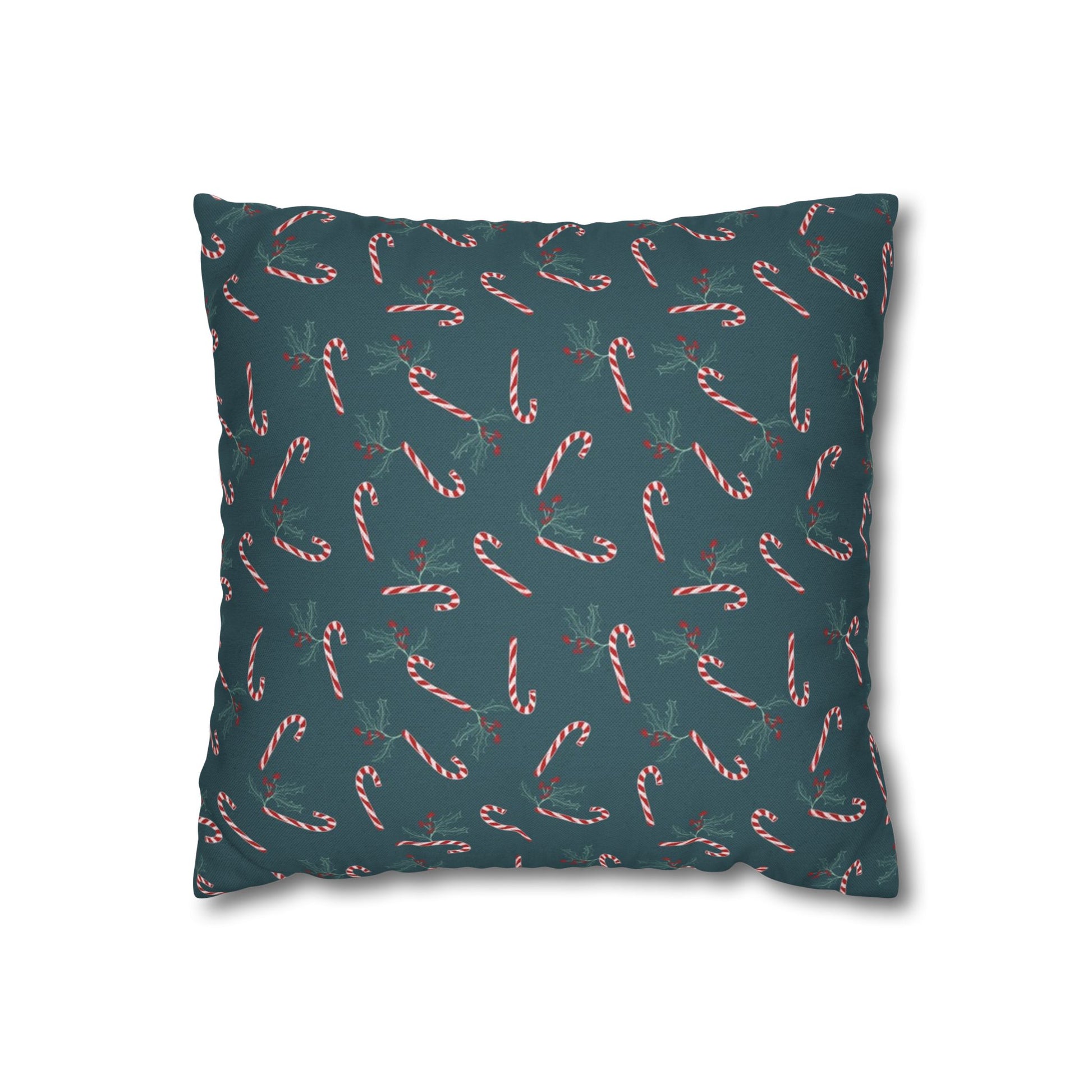 Front view of a square pillow case featuring a candy cane and holly pattern, displayed on a white background, highlighting the festive design details.