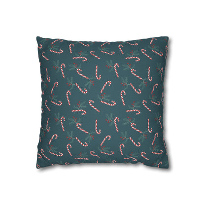 Front view of a square pillow case featuring a candy cane and holly pattern, displayed on a white background, highlighting the festive design details.