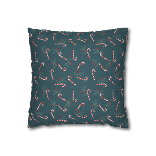 Front view of a square pillow case featuring a candy cane and holly pattern, displayed on a white background, highlighting the festive design details.