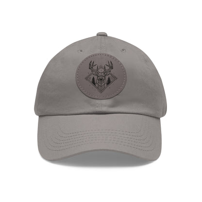 Front view in grey option of the Geometric Buck Dad Hat on a white background, showcasing a vegan leather patch with stylized buck and pine tree design on soft chino twill fabric.