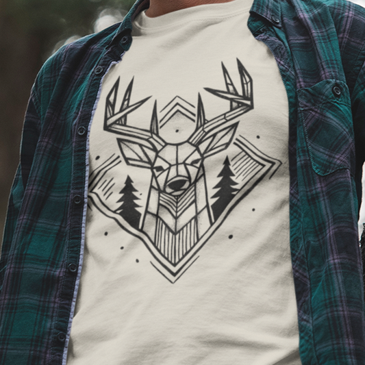 Geometric Buck Head T-Shirt worn by a model, showcasing its rustic deer design framed by pine trees—perfect for hunters and nature lovers.