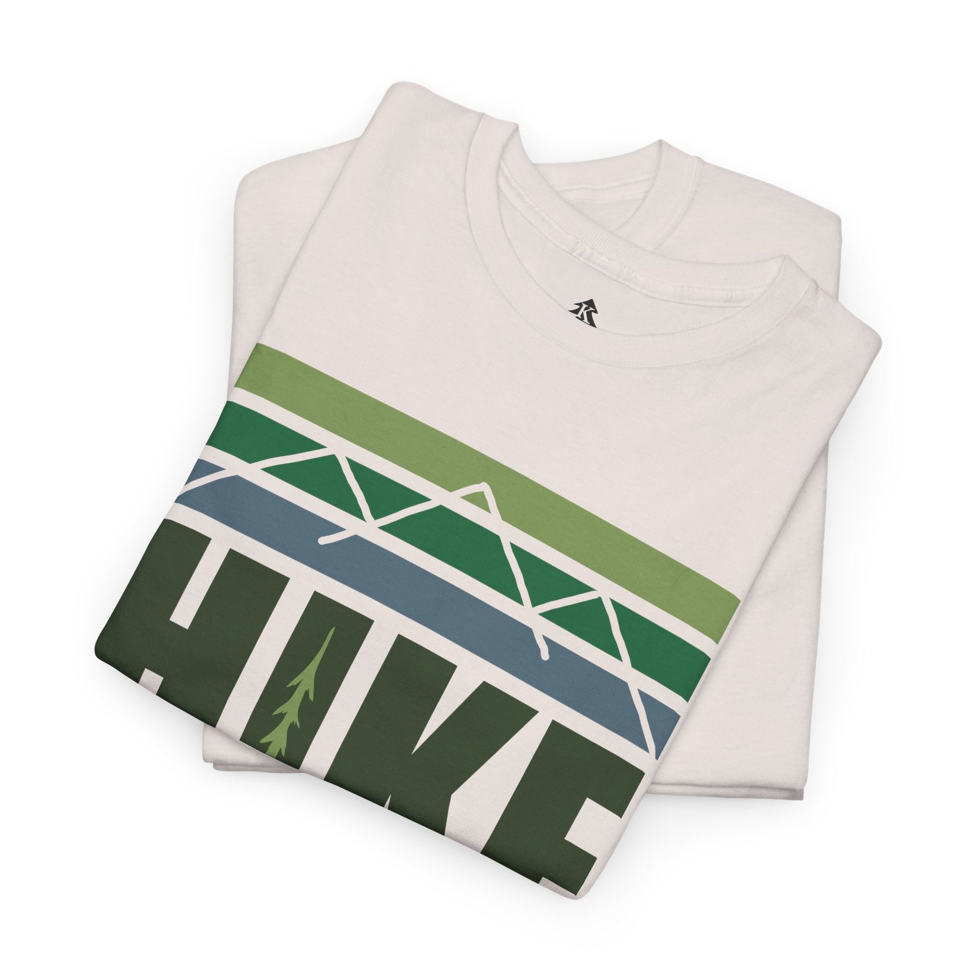 Ice Gray folded Hike Mountain Graphic T-Shirt on a white background, showcasing the bold mountain and tree design, perfect for hikers and outdoor adventure lovers.