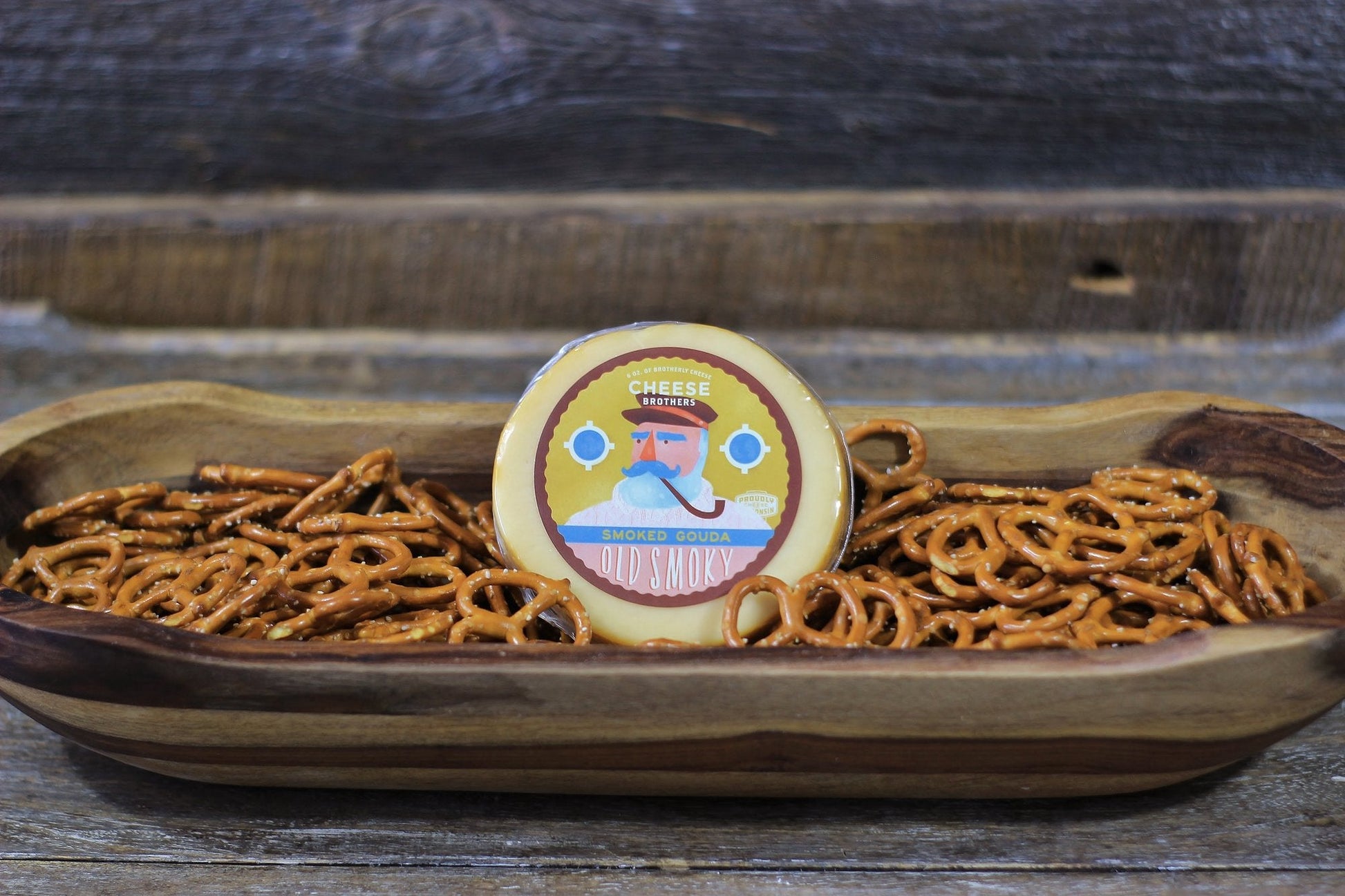 A Housewarming Gift Pack featuring Cheese Brothers 8-Year Aged Cheddar and Artisan Dill Havarti curated by Kempain Family Outfitters.