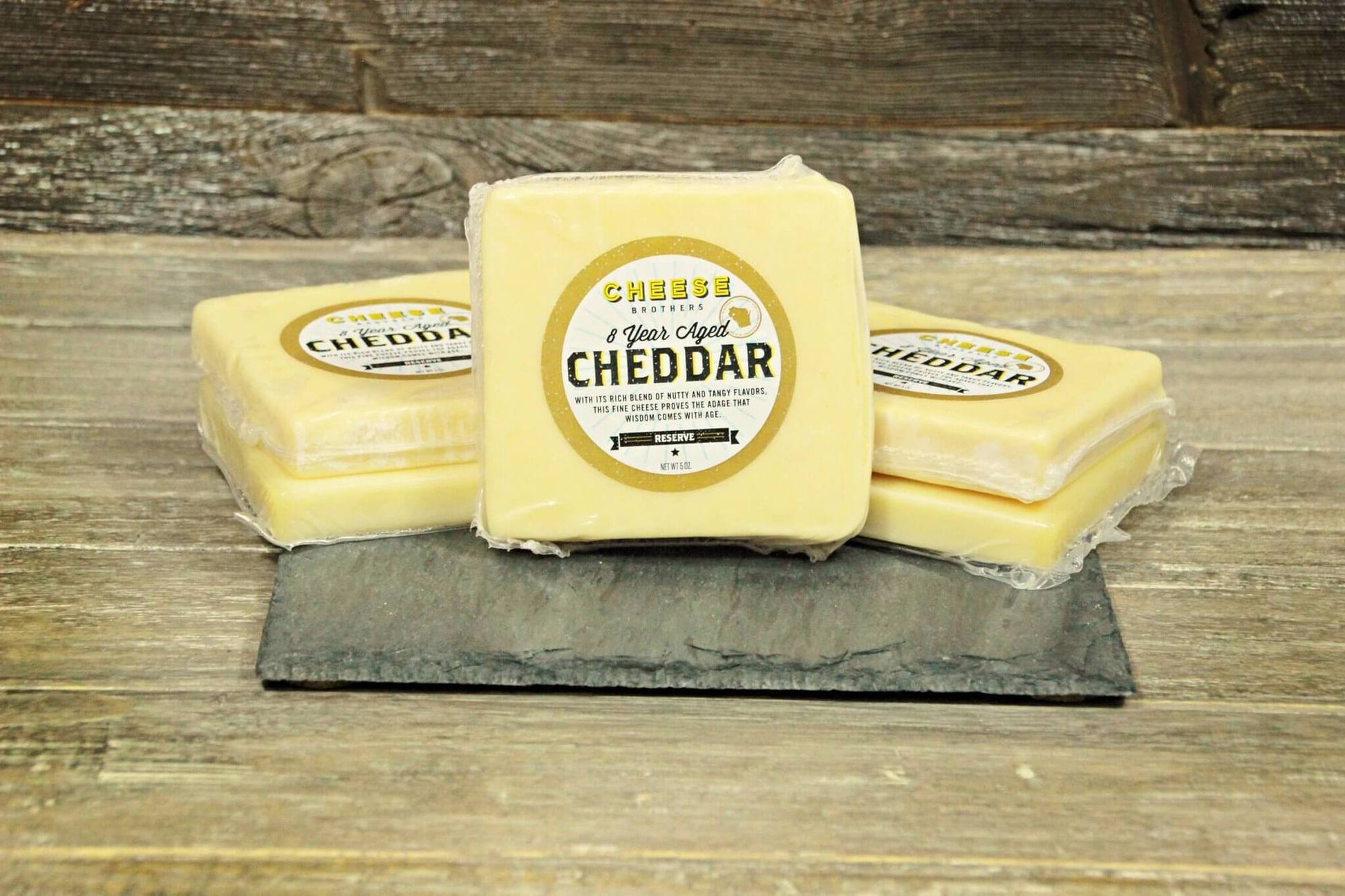 A Housewarming Gift Pack featuring Cheese Brothers 8-Year Aged Cheddar and Artisan Dill Havarti curated by Kempain Family Outfitters.