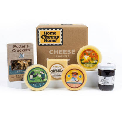 A Housewarming Gift Pack featuring Cheese Brothers 8-Year Aged Cheddar and Artisan Dill Havarti curated by Kempain Family Outfitters.