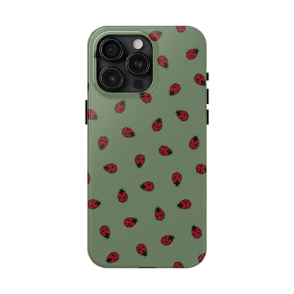Phone case with ladybug pattern on a green background