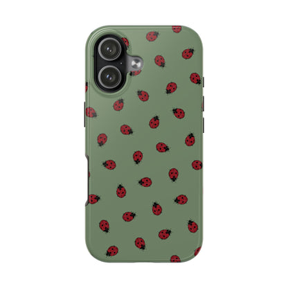 Phone case with ladybug pattern on a green background