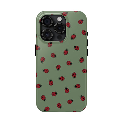 Phone case with ladybug pattern on a green background