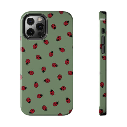 Phone case with ladybug pattern on a green background