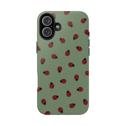 Phone case with ladybug pattern on a green background