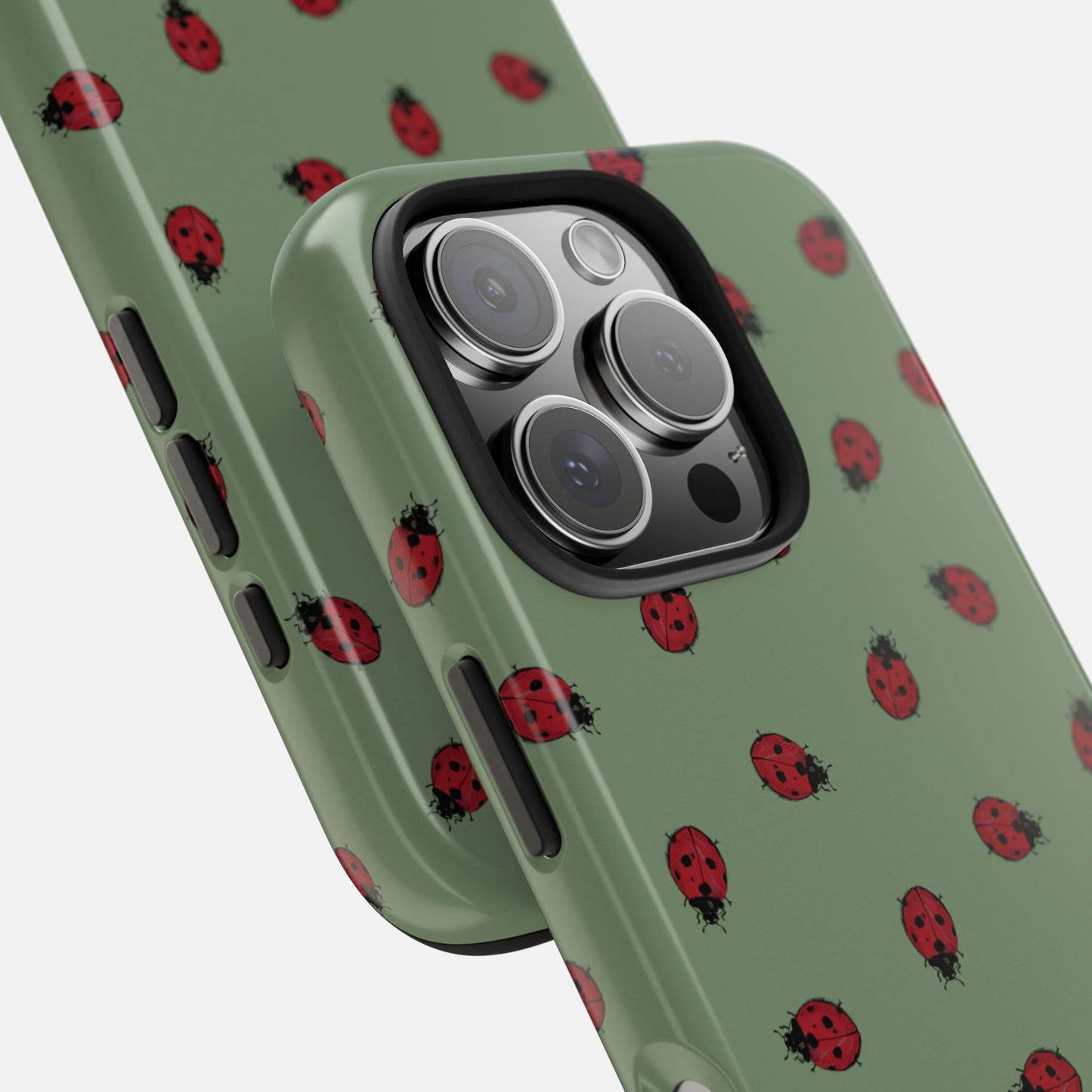Phone case with ladybug pattern on a green background