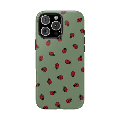 Phone case with ladybug pattern on a green background