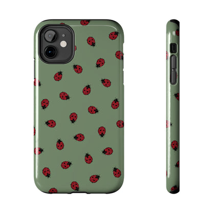 Phone case with ladybug pattern on a green background