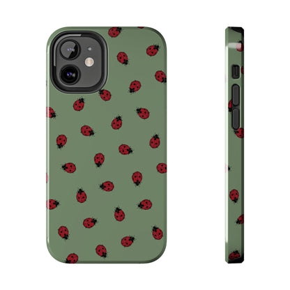 Phone case with ladybug pattern on a green background
