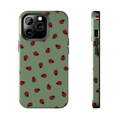 Phone case with ladybug pattern on a green background