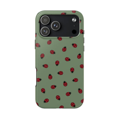 Phone case with ladybug pattern on a green background