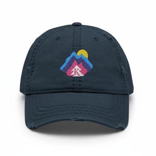  Front view of navy distressed dad hat on white background, featuring an embroidered mountain and sun design with the Kempain Family Outfitters tree + K emblem.