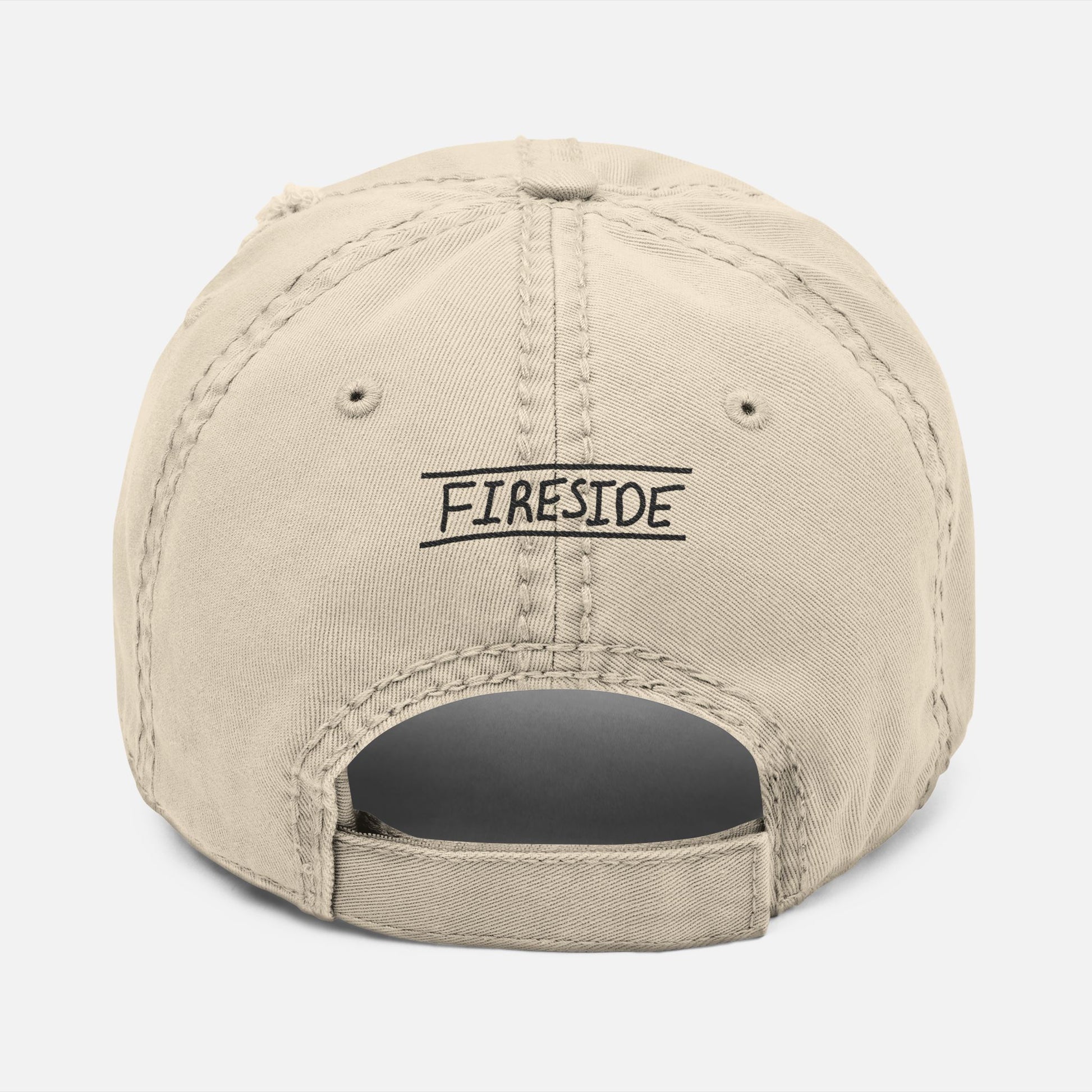 Back view of weathered dad hat with adjustable strap and “Fireside” embroidered in casual handwritten script.