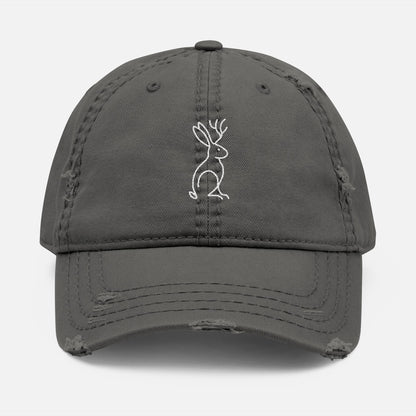 Front view of charcoal grey Mythborn Jackalope Dad Hat with Picasso-inspired line art of a jackalope, shown on white background.