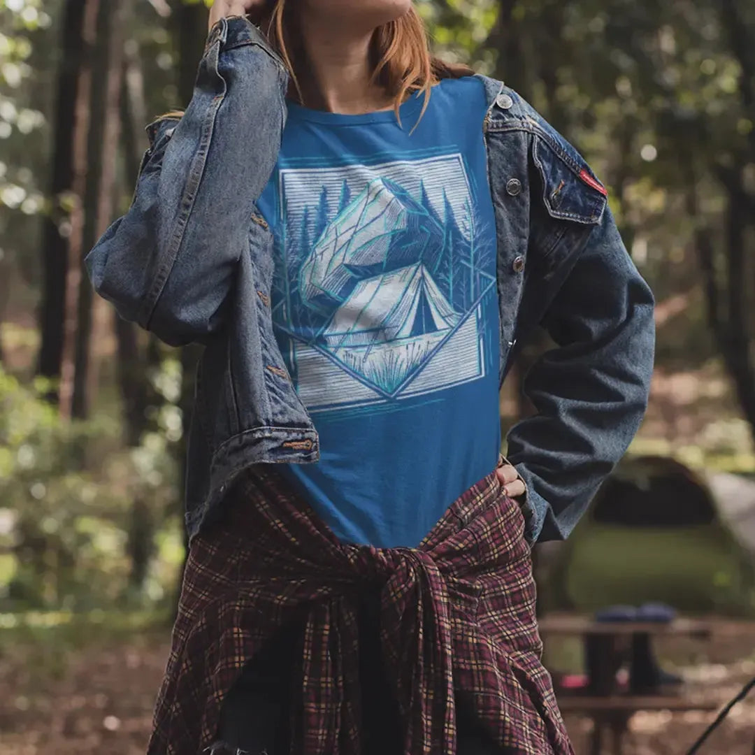 Off-the-Grid Camping T-Shirt worn by a female model, featuring a geometric tent and boulder illustration—perfect for campers, hikers, and outdoor adventurers, available in sizes Small through 5XL.