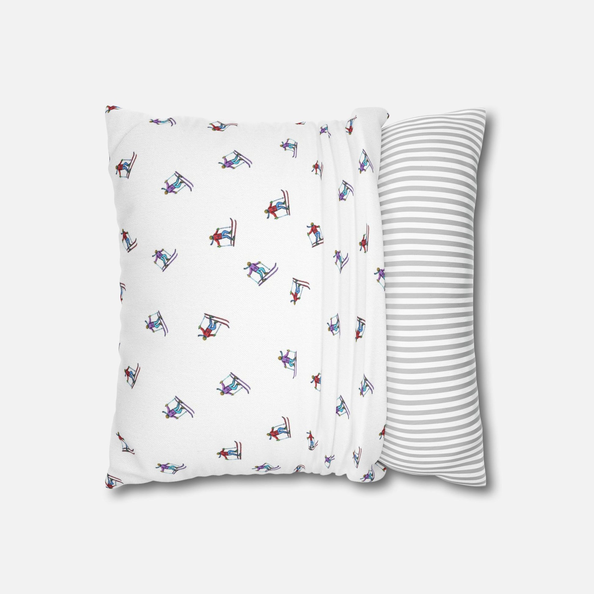 Pillow case with an illustrated skier pattern, partially fitted over a pillow on a white background, demonstrating how it goes over the pillow with the 'Carving the Slopes' design.