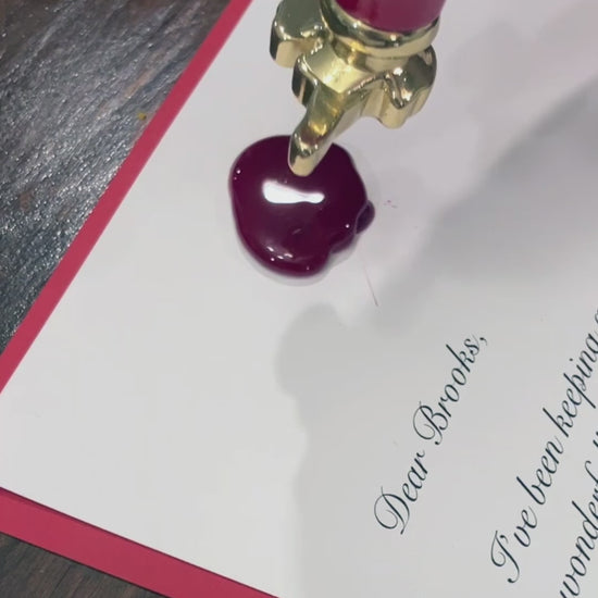 Video showcasing a personalized letter from Santa with a wax seal and envelope, highlighting the intricate details and custom design