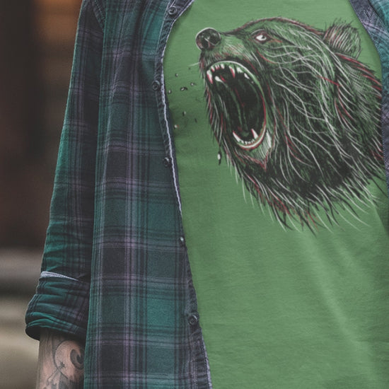 Model wearing Green Roaring Bear T-shirt unisex nature and wildlife graphic tee on white background.