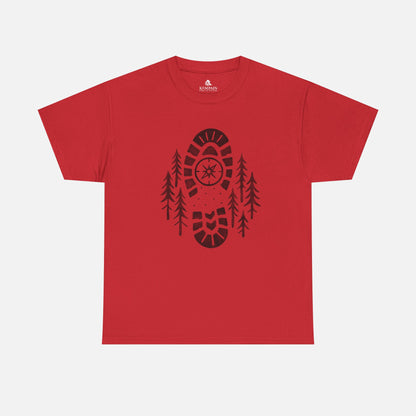 Red Boot Print Compass Forest T-Shirt worn by model in a pine forest setting, showcasing rugged hiking design for nature lovers.