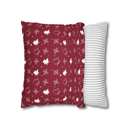 Red pillow case featuring a winter snowflake and tree pattern, partially fitted over a pillow, showing how it fits and highlighting the festive winter design.