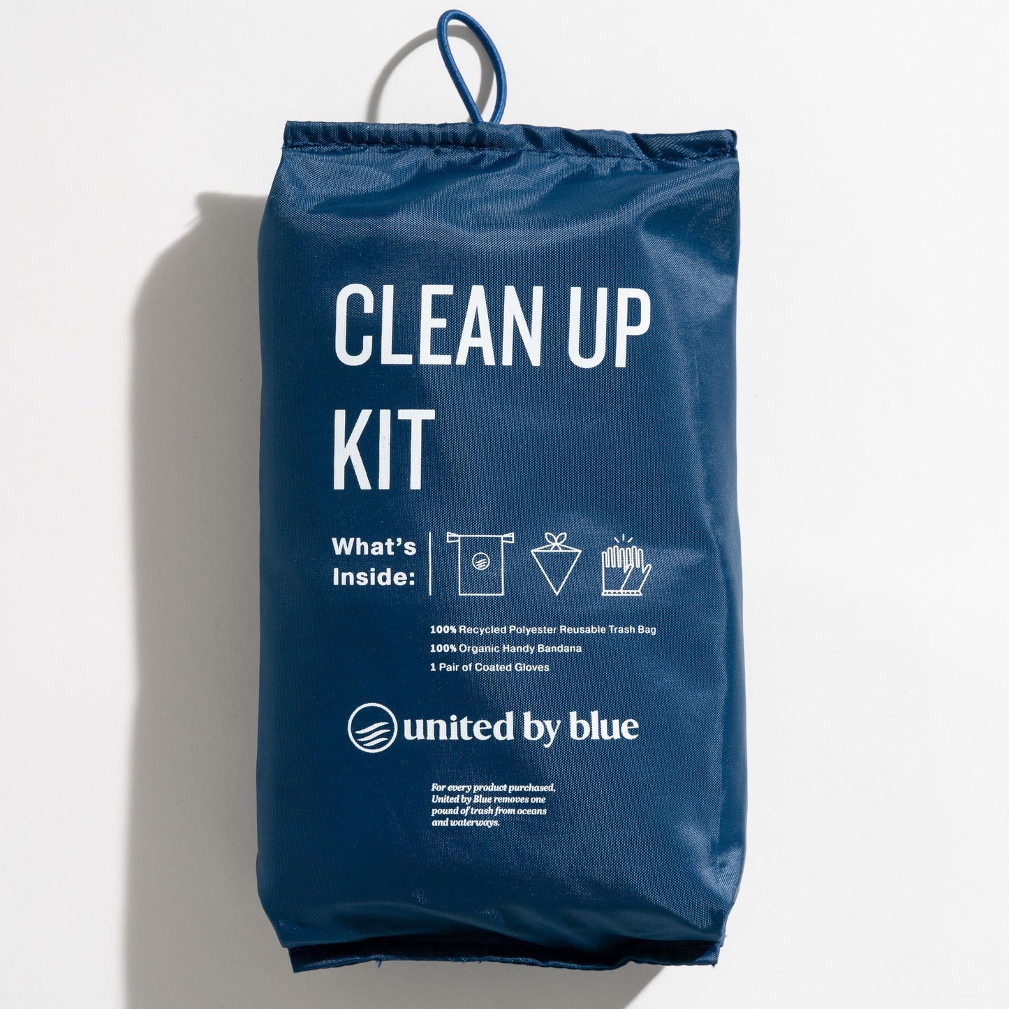 The reusable do it yourself trash cleanup Kit bag - recycled and organic by United By Blue displayed on a white background.