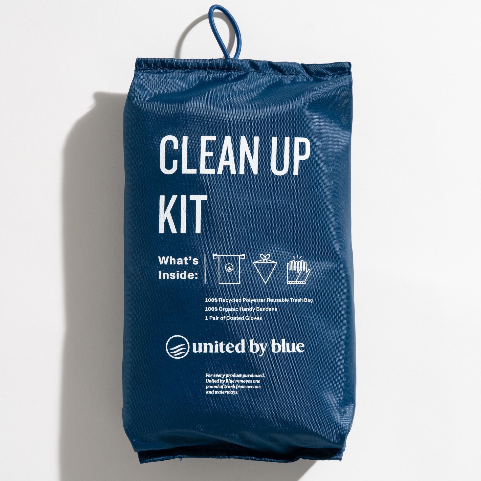 The reusable do it yourself trash cleanup Kit bag - recycled and organic by United By Blue displayed on a white background.